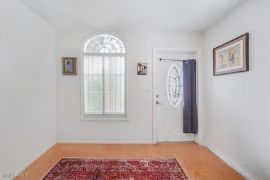 Entrance foyer featuring baseboards