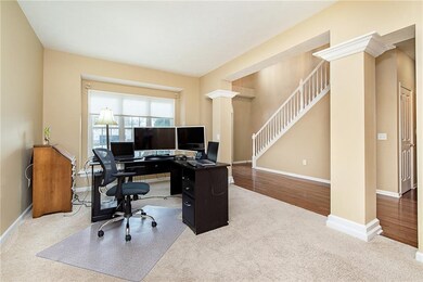 Formal living room currently being used as an office. 