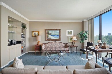 The living room features a wet bar and built-ins t