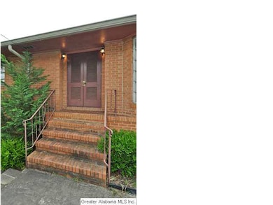 Front entryway with double, louvered doors.