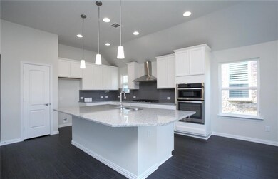 NEW CONSTRUCTION: Island kitchen with pendant ligh