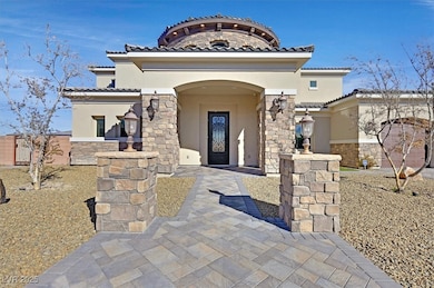 View of front facade with stucco siding, stone sid