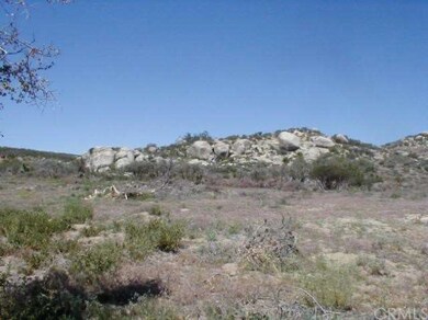 LARGE ROCK FORMATION TO TOWARD THE NORTH BOUNDARY 