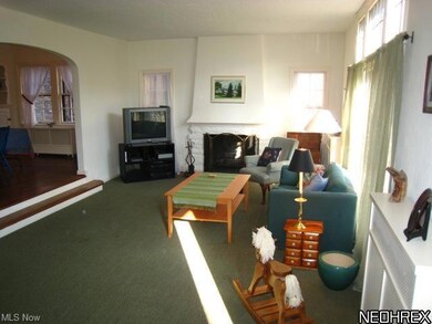 Floor to ceiling leaded glass windows, fireplace a