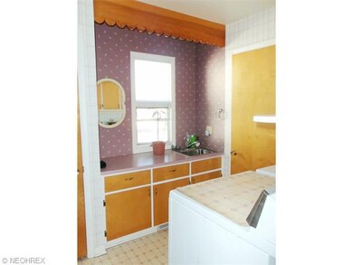 Rear Entry into 1st floor Laundry room with large 