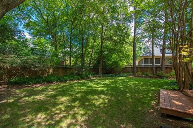 Fenced rear yard with lush landscaping