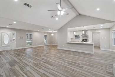 Vaulted ceiling in living room with gas fireplace