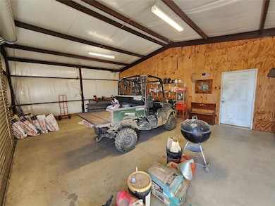 Garage featuring wooden walls