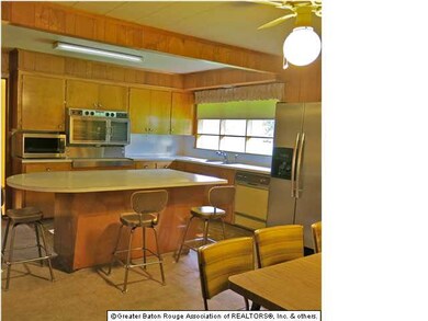 Main Kitchen with Island & Wide Window Overlooking