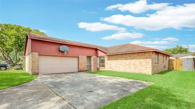 Double wide driveway leads to 2 car garage