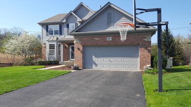 Wide 2 Car Garage and Driveway. Covered Front Porc