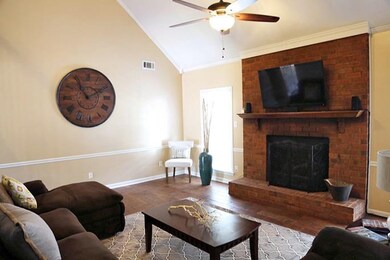 The living room also has a cozy fireplace!
