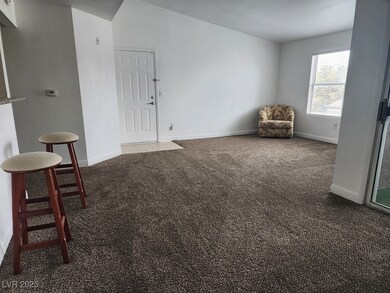 Empty room featuring carpet floors and baseboards