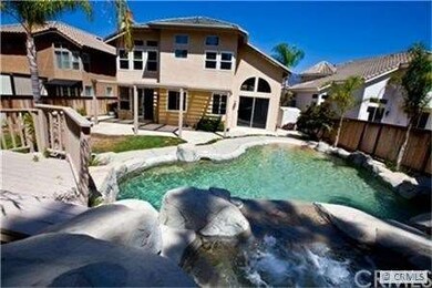 Jacuzzi flows from a waterfall into the pool below