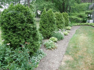 Lush plantings create a pretty entrance as well as