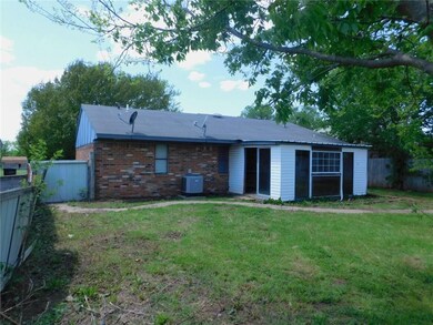 Back of home has add on patio room