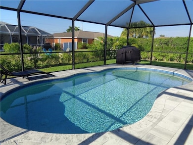 Outdoor pool featuring a lanai