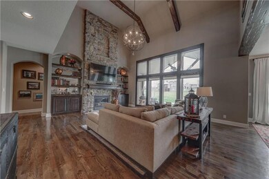 Floor to Ceiling Stacked Stone Gas Fireplace