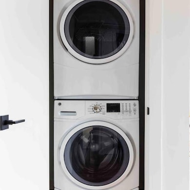 Clothes washing area with stacked washing maching 