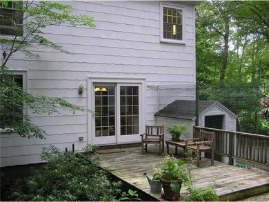 Exterior Back. Rear deck with slider...