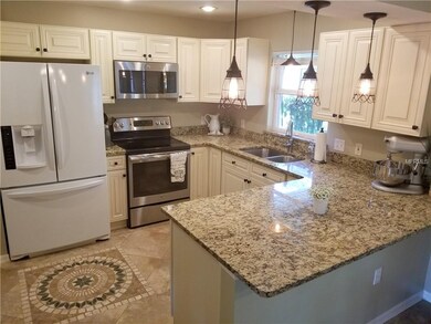 Kitchen; Custom cabinetry, tile floors with inlays