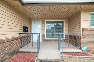 Entrance to property with brick siding