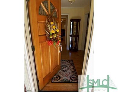 Foyer. The inviting front entry has a hardwood doo