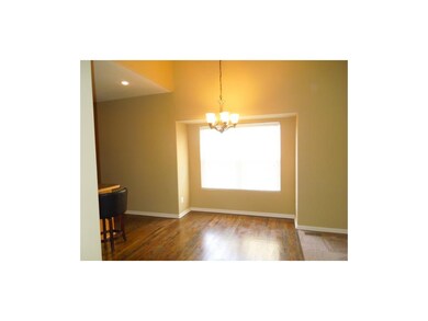 Beautiful dining area on hard wood floor.