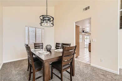 Dining space with light tile patterned flooring, a