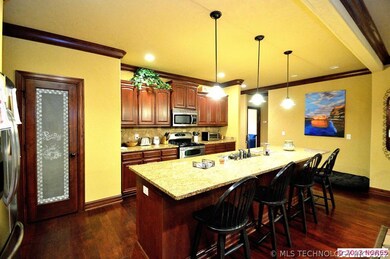 Other features of the kitchen include tumbled tile