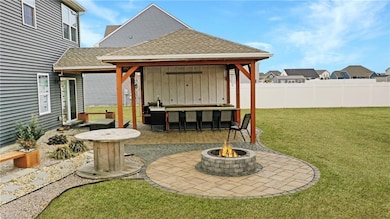 Smores over the firepit with a beautifully crafted covered patio and outdoor kitchen every evening