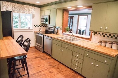 Bright Kitchen With Stainless Steel Appliances