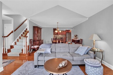 Living room into dining room off entry to the left