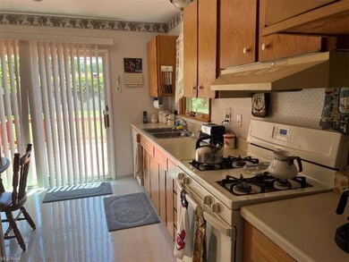 Sunny Kitchen w/plenty of counter space & cabinets.