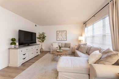Living room featuring light hardwood / wood-style 