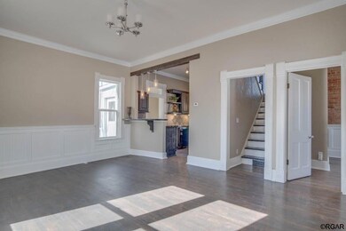 Living Room with entrance to Kitchen, Bedroom and