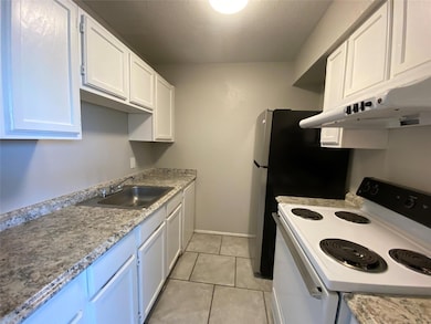 Here is a view of this cozy kitchen. Notice the st