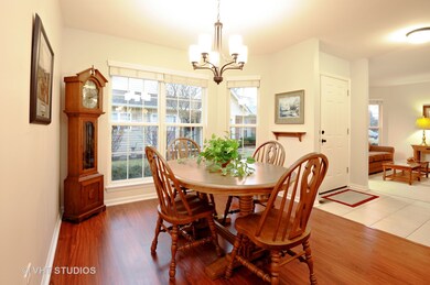Great sunny Dining Room with wood laminate floorin