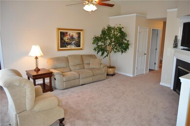 Open Living Room w/cathedral ceiling and fireplace!