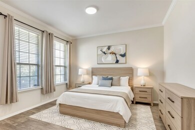 Digitally staged primary bedroom. Concept 2