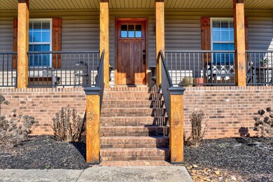 Newly Updated Front Porch with Cedar Posts and Shutters
