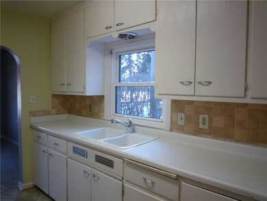 Painted cabinets and neutral countertops