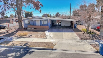 View of front of property featuring driveway, an a