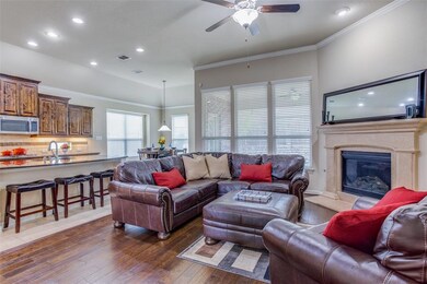 Large family room with lots of windows, a gas fire