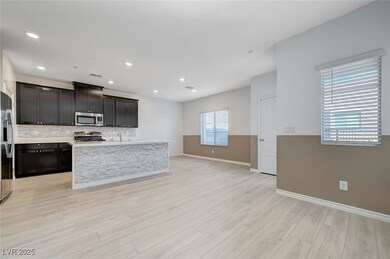 Kitchen with decorative backsplash, light countert