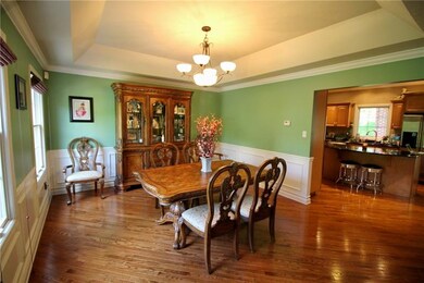 Dining room with crown & chair rail moldings & wai