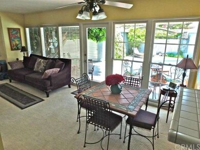 Living room with view to pool and rear patio.
