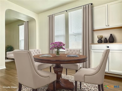 Dining area virtually staged.