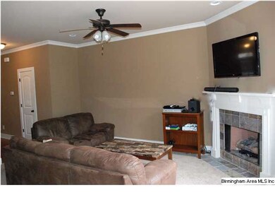 Living room with gas logs fireplace.