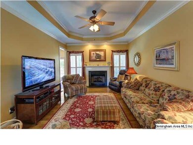 Living room features gas log fireplace with slate 
